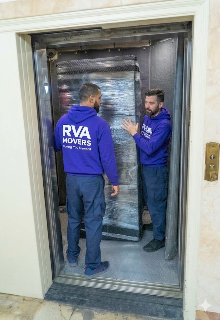 RVA Movers crew navigating furniture through apartment elevator