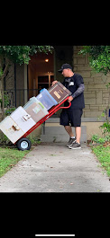 RVA Movers crew carrying furniture up apartment stairs